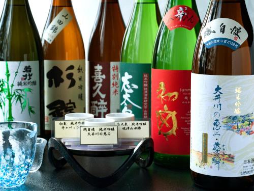 a group of bottles of wine on a table at Migiwaya in Yaizu