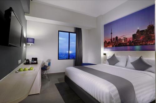 Postel nebo postele na pokoji v ubytování Hotel Neo+ Kebayoran Jakarta