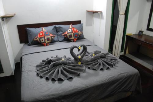 Кровать или кровати в номере Wikarmas Villa Sanur
