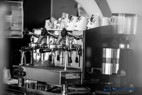 a coffee machine with cups on top of it at Hotel Relax Roma Nord in Fiano Romano