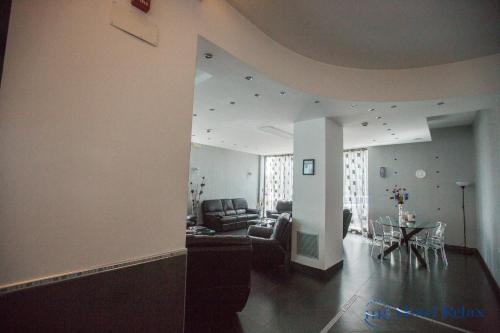 a living room with a couch and a table at Hotel Relax Roma Nord in Fiano Romano