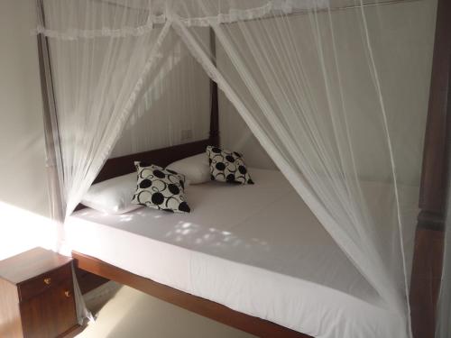 Ένα ή περισσότερα κρεβάτια σε δωμάτιο στο New Jaya Villa