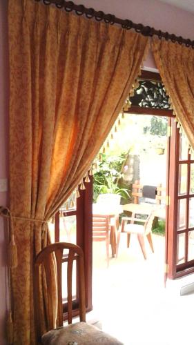 a room with a window with a curtain at Diamond Villa in Bentota