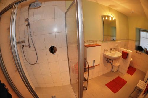 a bathroom with a shower and a sink at Bauernhof Gfraser in Serfaus