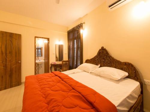Een bed of bedden in een kamer bij Saudades Homestays