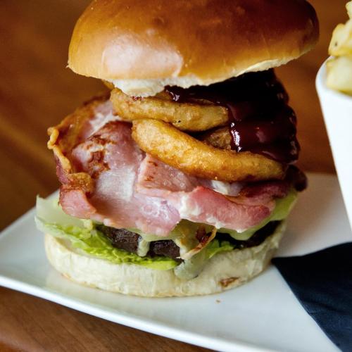 a sandwich with bacon lettuce and cheese and a french fry at Holborn Hotel in Thurso