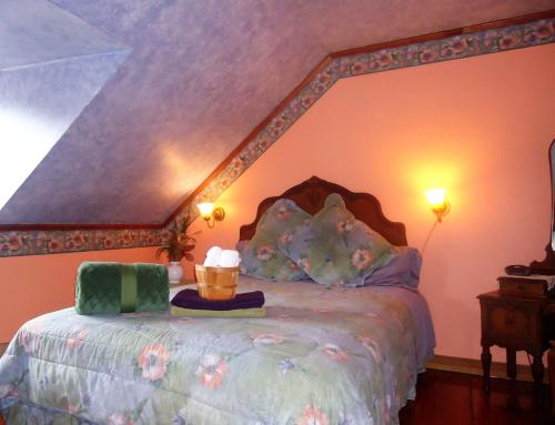 a bedroom with a large bed with a canopy at Gîte À l'Augustine in Quebec City