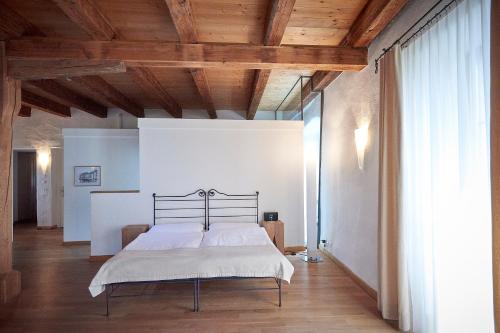 
Ein Bett oder Betten in einem Zimmer der Unterkunft Hotel Rathaus-Ristorante Pizzicata
