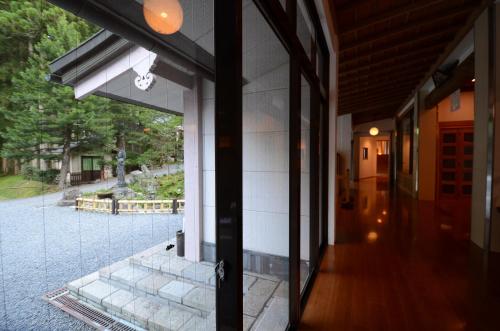an entrance to a building with a glass door at 高野山 宿坊 不動院 -Koyasan Shukubo Fudoin- in Koyasan