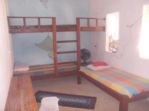 Postel nebo postele na pokoji v ubytování Hospedagem Mirage Igatu