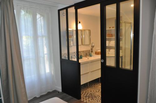 Ванная комната в Au Rez de Jardin