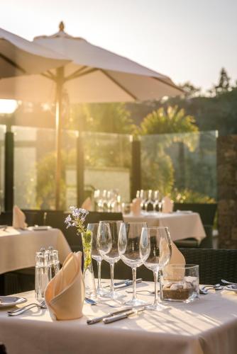 a table with wine glasses sitting on top of it at Casa León Royal Retreat in Maspalomas