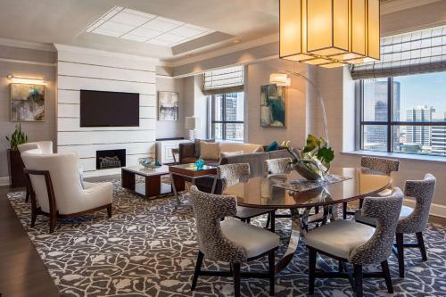 a living room with a table and chairs at Hyatt Regency Saint Louis at The Arch in Saint Louis
