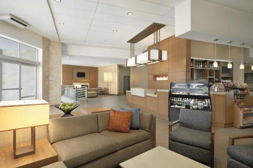 a lobby with a couch and chairs in a store at Hyatt Place Salt Lake City/Cottonwood in Cottonwood Heights