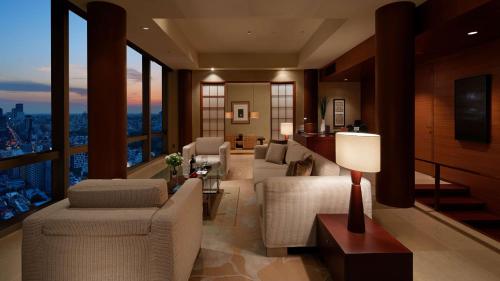 a living room with a view of a city at Grand Hyatt Tokyo in Tokyo