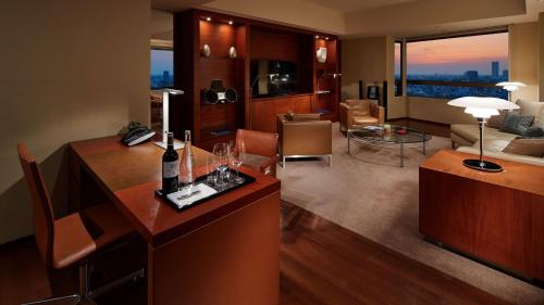 a living room with a table with wine glasses on it at Grand Hyatt Tokyo in Tokyo
