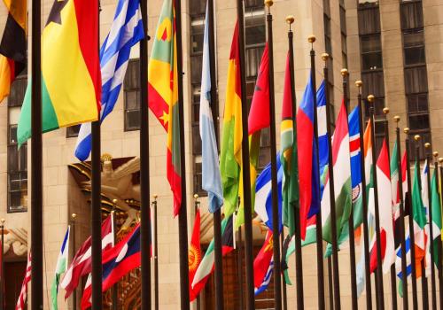 a bunch of different flags in front of a building at Hyatt House New York/Chelsea in New York