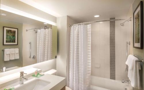 a bathroom with a sink and a shower at Hyatt Place Washington D.C./National Mall in Washington