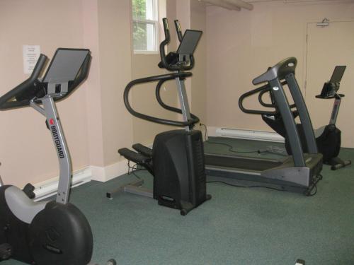 a gym with two exercise bikes and a treadmill at Glynmill Inn in Corner Brook