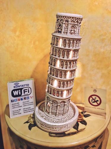 a white tower with lights on top of a table at Hotel Villa Primavera in Pisa