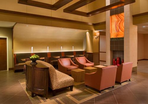 a lobby with chairs and a waiting room at Hyatt Place San Antonio Riverwalk in San Antonio