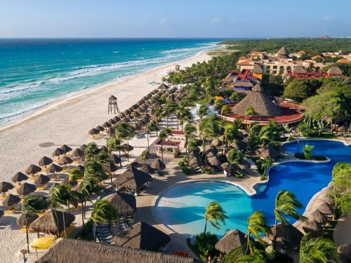 an aerial view of the beach at the excellence punta cana resort at Iberostar Waves Quetzal - All Inclusive in Playa del Carmen