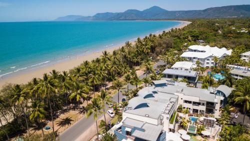 an aerial view of a resort and the beach at Port Douglas Peninsula Boutique Hotel - Adults Only Haven in Port Douglas