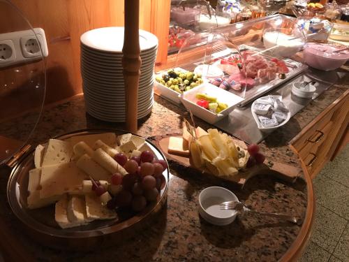 a counter top with a bunch of food on it at Landhaus Kössel in Füssen