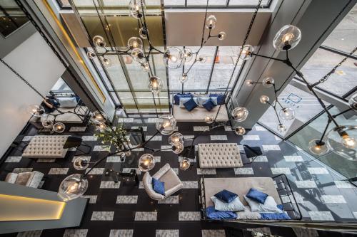 an overhead view of a dining room with a chandelier at Z Sleep Hotel in Hat Yai