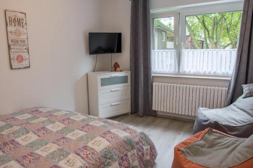 Llit o llits en una habitació de Ferienwohnung Bärbel