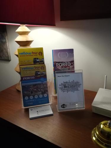 three boxes on a table with a lamp and a laptop at Near the Airport in Moreira