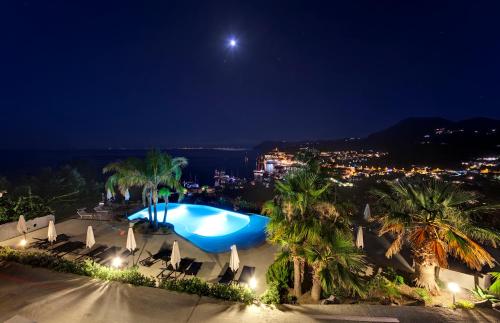 a view of a swimming pool at night at Hotel Villa Enrica - Aeolian Charme in Lipari