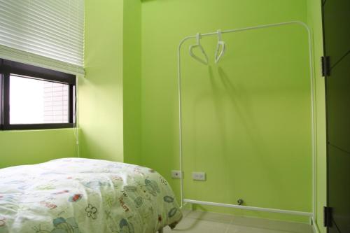 Postel nebo postele na pokoji v ubytování LiveGRACE Apartment Xindian