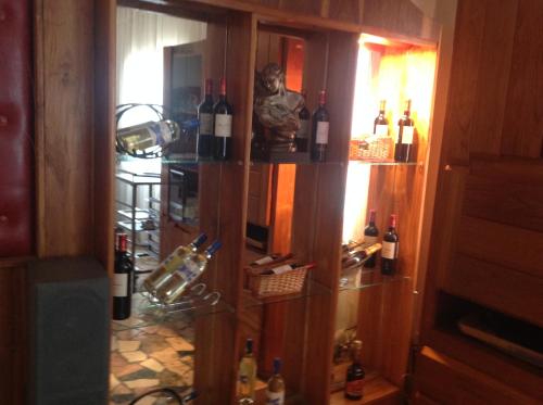a room with a bunch of bottles of wine at Hotel Ambassadors in Lomé