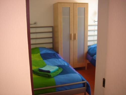 a bedroom with a bunk bed and a mirror at Quinta Boavista in Cercal