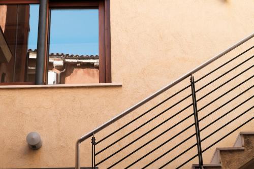 a building with a staircase and a window at Ca' Pozzo Inn in Venice