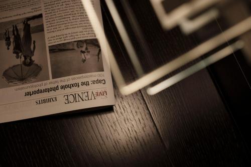 a newspaper sitting on top of a table at Ca' Pozzo Inn in Venice