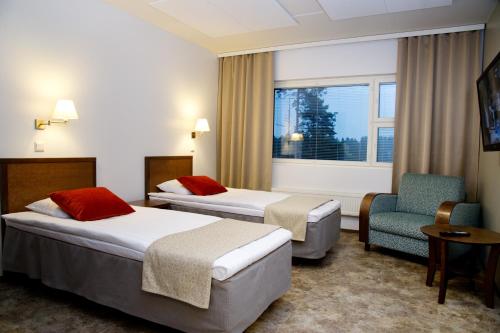 Un pat sau paturi într-o cameră la Eerikkilä Sport & Outdoor Resort