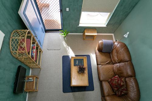 an overhead view of a living room with a couch and a table at Dolphin Lodge Albany - Self Contained Apartments at Middleton Beach in Albany