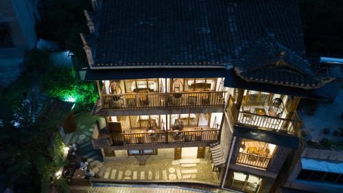 an overhead view of a building at night at Wang Jiang Reclusive Boutique Inn in Fenghuang