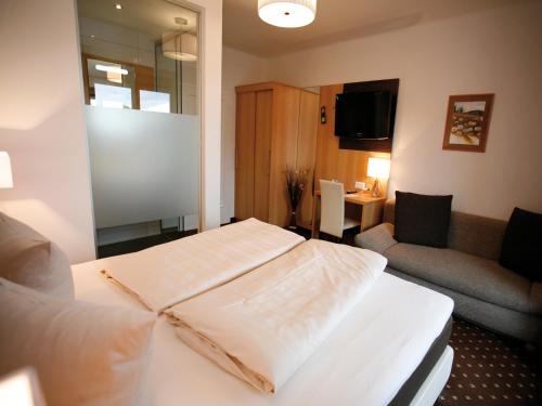 Кровать или кровати в номере Hotel Diana