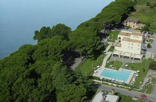 an aerial view of a house on a hill near the water at Hotel Holiday Sul Lago in Bolsena