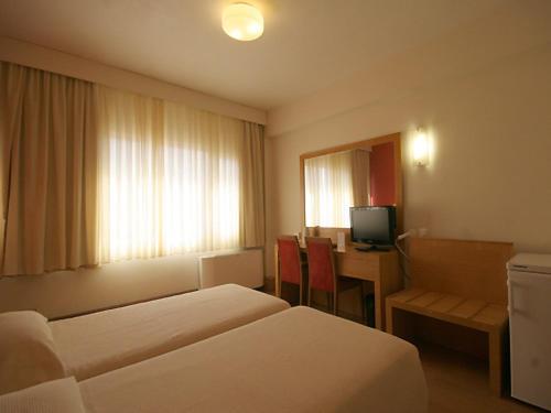 Postel nebo postele na pokoji v ubytování Diana Hotel