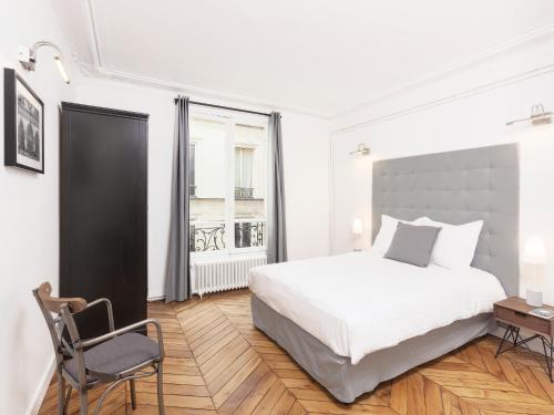 Katil atau katil-katil dalam bilik di LivinParis - Luxury 4 Bedrooms Opera Lafayette II