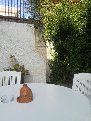 a table with a vase sitting on top of it at Castle By The Sea in Artemida