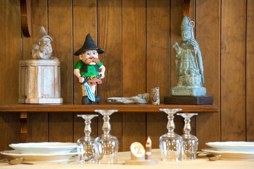 a shelf with a figurine of a witch on it at Albergo Castello da Bonino in Champorcher