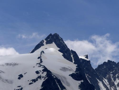a mountain with snow on top of it at Alpenhof Apartments in Mittersill