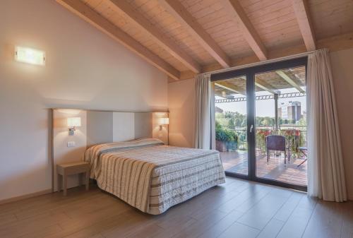 Tempat tidur dalam kamar di Cà dell'Orto Rooms & Apartments