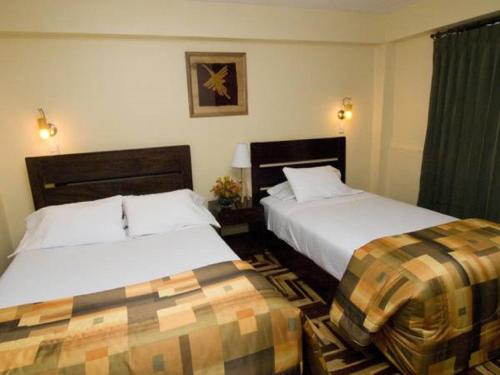 Ένα ή περισσότερα κρεβάτια σε δωμάτιο στο Hostal Samichay