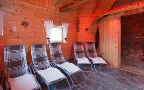 four chairs sitting in a room with a window at Haus Angelika in Vandans